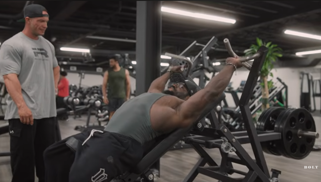 Terrrence Ruffin working out at Volt's Gym in New Jersy while talking to a fan.